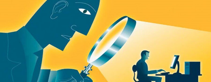 boss overseeing employee with magnifying glass